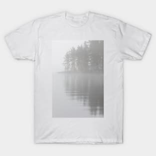 Trees reflection at lake foggy morning T-Shirt